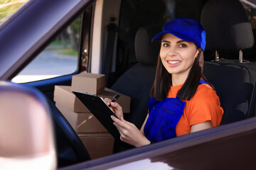 Poster - Courier with clipboard checking packages in car