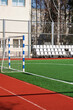 © Vera Aksionava - Green soccer field behind the fence closeup