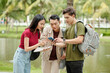© DragonImages - College students checking schedule via application on smartphone