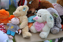 Collection Of Cute Soft Toys On Outdoor Market Stall 