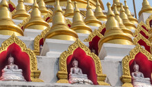 Buddha Statue And Golden Stupas At The Wat Manee Praison Temple In Mae Sot Thailand