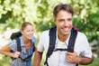 © STEEX/peopleimages.com - Leading the way. A young couple standing outside with their backpacks on.