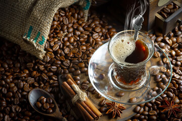 Wall Mural - Espresso coffee with coffee beans on old background.