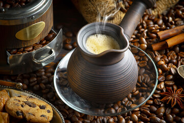 Wall Mural - Espresso coffee with coffee beans on old background.