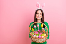 Photo Of Pretty Cheerful Person Hands Hold Festive Easter Basket Painted Eggs Cookies Food Look Empty Space Isolated On Pink Color Background
