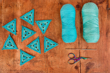 Wall Mural - Blue triangle crochet patterns, two skeins of yarn, a hook and s