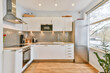 © ADDICTIVE STOCK - Modern kitchen interior with built in appliances