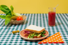 Delicious Smoothie And Healthy Sandwich On Checkered Tablecloth
