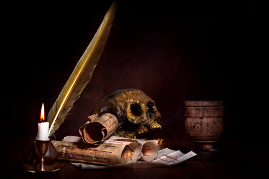 medieval occult still life with skull and candle