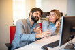 © Bojan - Confidence business man showing off while explaining project details to his beautiful female colleague on a meeting at office.