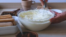 The process of cooking tiramisu. Making cream for tiramisu