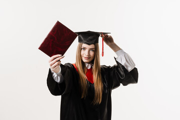 Wall Mural - Confident student with diploma in graduation robe and cap ready to finish college. Future leader of science. Academician young woman in black gown smiling.