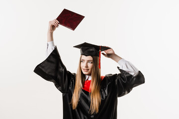 Wall Mural - Confident student with diploma in graduation robe and cap ready to finish college. Future leader of science. Academician young woman in black gown smiling.