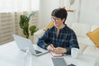 © satura_ - Work online remote from home concept. Woman relaxing in pajama while video call meeting
