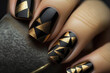 beautiful painted fingernails in gold and black, manicure