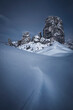 Cinque Torri rock formations in the blue hour during a snowy winter in Cortina d'Ampezzo, Italy
