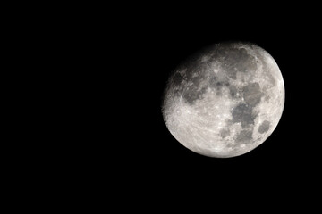 Wall Mural - the moon is earth's only natural satellite. it is the fifth largest satellite in the solar system