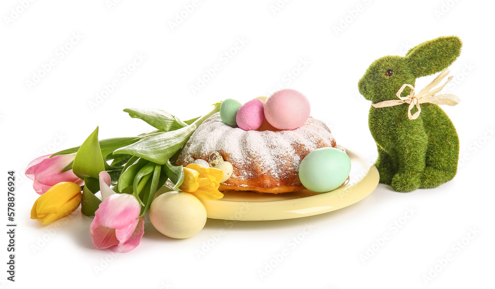 Tasty Easter cake, tulip flowers, toy bunny and painted eggs on white background