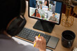 © weedezign - asian woman video conference business meeting with colleage online with tablet at home