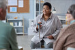 © Seventyfour - Portrait of senior black woman sitting in circle at mental health support group in retirement home