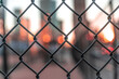 © Cavan Images - Fence against a background of skyline
