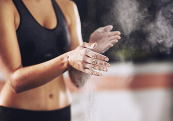 Sticker - Shes fighting fit. a woman coating her hands with sports chalk before a workout.