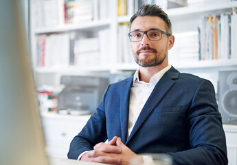 Canvas Print - Hes really good at his job. a businessman in his office.