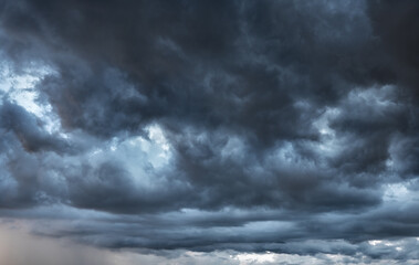 dark clouds make sky in black. heavy rain thunderstorm. pattern of clouds overcast predict tornado, 