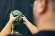 © primipil - Man sculptor creates sculpt bust clay human woman sculpture. Statue craft creation workshop.