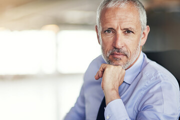 Aufkleber - Hes focussed and determined. Cropped portrait of a mature businessman sitting in his office.
