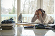 © AUFORT Jérome - mixed race woman ironing at home