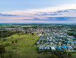 © Austockphoto - Drone view over edge of suburbia to countryside edge of urban development