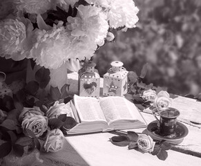 Wall Mural - Book and coffee near a bouquet of flowers