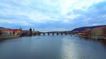 Canvas Print - Cloudy sky over Vltava River and Charles Bridge, Prague, Czechia