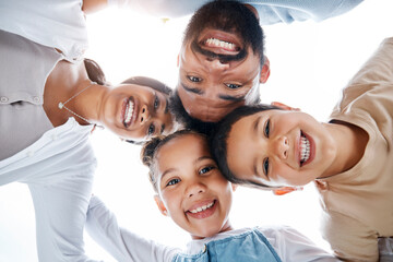 Sticker - Huddled family bonding, laughing and having fun while standing in a circle with heads in the middle. Below playful portrait of excited, happy and cheerful mother, father and children close together