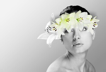 Abstract collage of young woman with fresh flowers on face