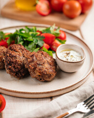 Wall Mural - Portion of russian beef cutlets with sauce and salad