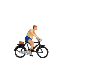 Miniature people travellers with bicycle isolate on white background with clipping path