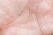 © banjongseal324 - Macro image of the skin texture of the human palm,Macro image of the surface texture of the human palm,Close up skin texture with wrinkles on body human,Hand closeup view