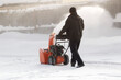 © Александр Поташев - A portable snow blower powered by gasoline. Snow removal in winter.