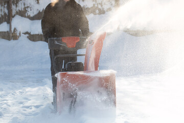 Wall Mural - A portable snow blower powered by gasoline. Snow removal in winter.