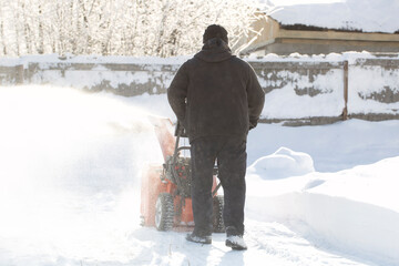 Wall Mural - A portable snow blower powered by gasoline. Snow removal in winter.