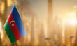 Small flags of the Azerbaijan on an abstract blurry background