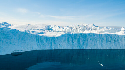 Wall Mural - giant iceberg. global warming and climate change concept. icebergs in disko bay on greenland in ilul
