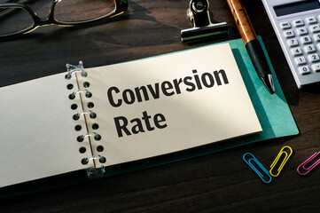 Leinwandbilder - There is a notebook with the word Conversion Rate. It is eye-catching image.