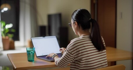 Poster - Woman work on laptop computer at home in the evening