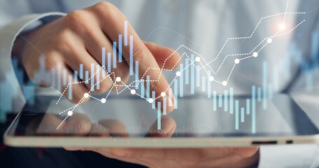 Digital interface on the screen and businessman hand