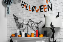 Fireplace With Different Halloween Decor Indoors. Festive Interior