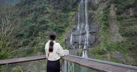 Wall Mural - Woman go day trip in Beautiful waterfall mountain at Wulai of Taiwan