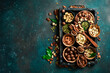 © Yaruniv-Studio - Assortment of nuts in a wooden box on a black background - healthy snack. Top view. Copy space